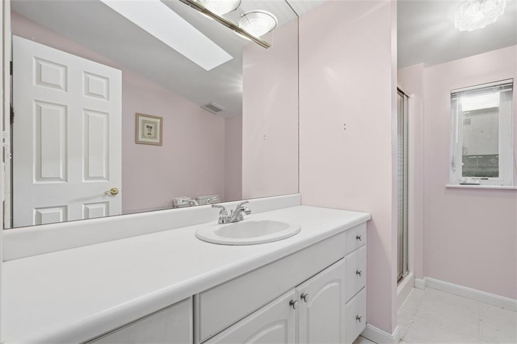 126 Leon Road Pittsburgh, PA 15220 - Photo 32 of 50 a bathroom with a sink and a mirror