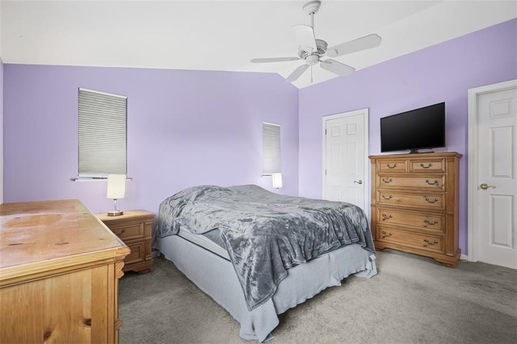 126 Leon Road Pittsburgh, PA 15220 - Photo 35 of 50 a bedroom with a bed and a flat screen tv