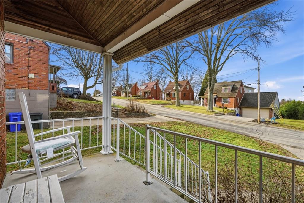 126 Leon Road Pittsburgh, PA 15220 - Photo 4 of 50 a view of a chair and tables in the balcony