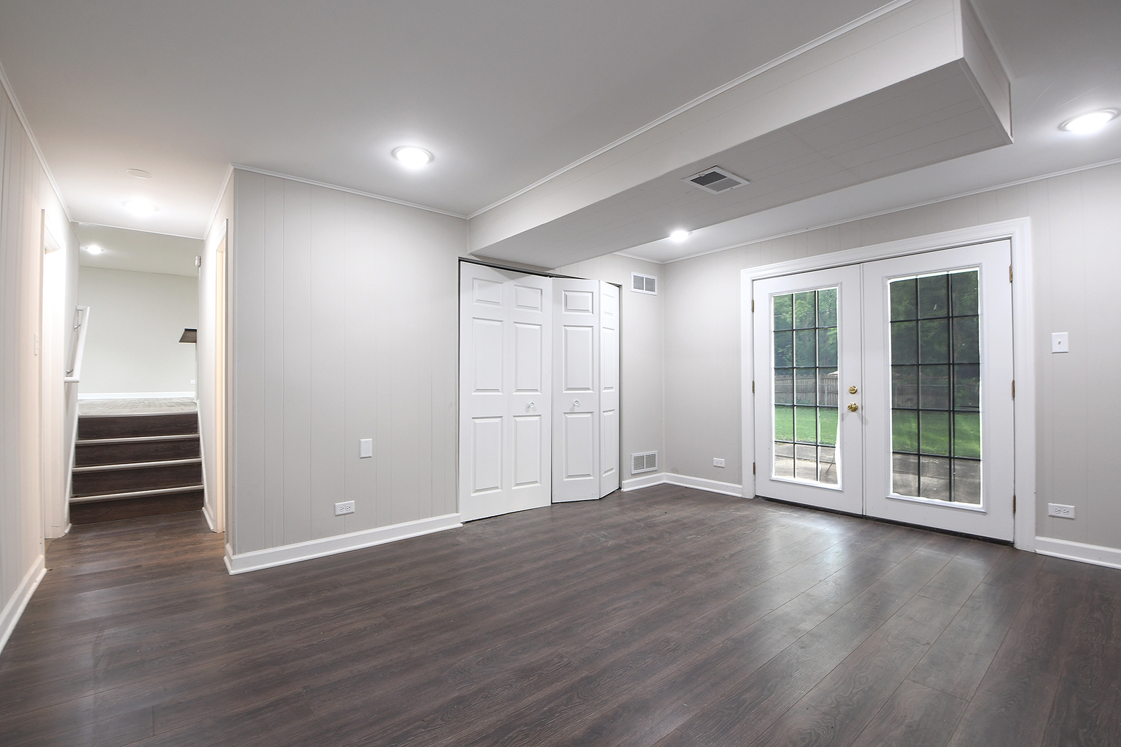 18938 Jonathan Lane Homewood, IL 60430 - Photo 11 of 33 an empty room with wooden floor and windows
