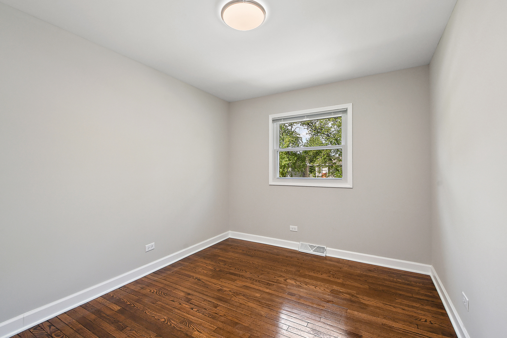 18938 Jonathan Lane Homewood, IL 60430 - Photo 19 of 33 wooden floor in an empty room with a window