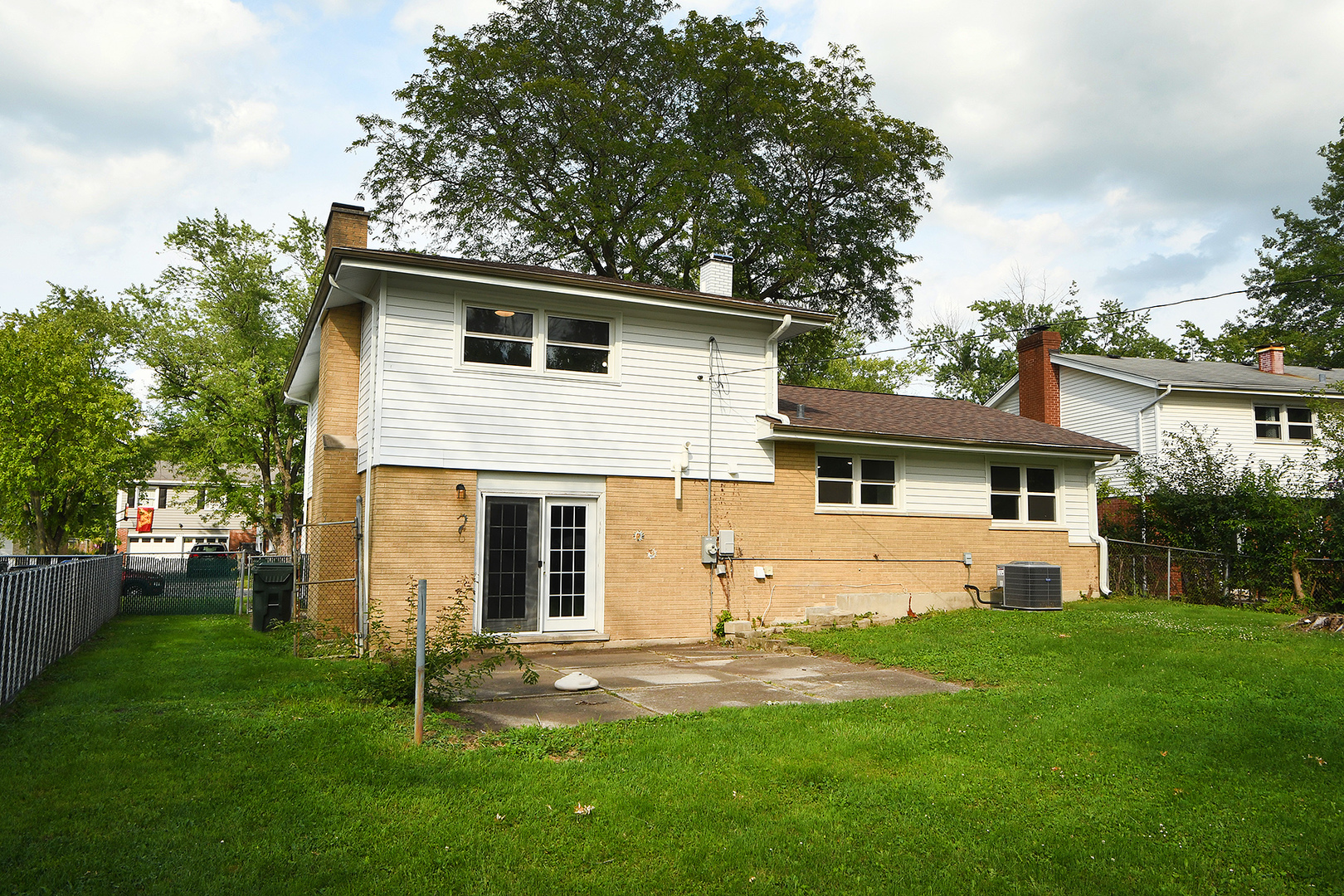 18938 Jonathan Lane Homewood, IL 60430 - Photo 23 of 33 a view of a yard in front of a house with plants and large tree