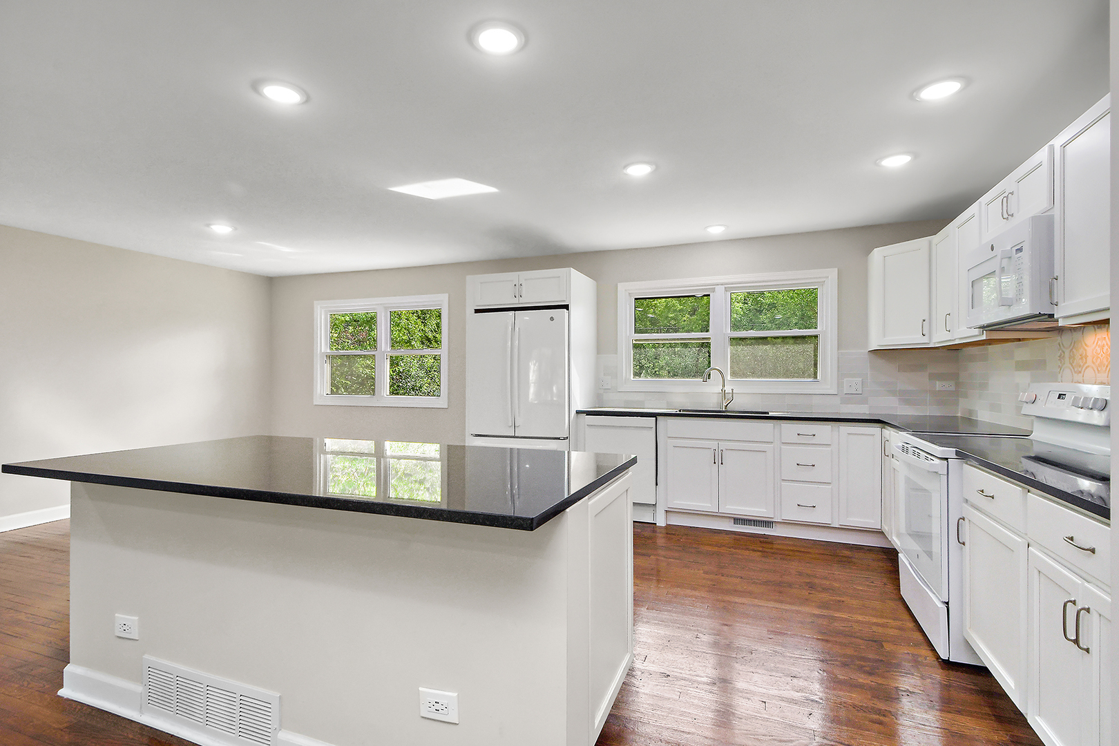 18938 Jonathan Lane Homewood, IL 60430 - Photo 7 of 33 a kitchen that has a sink a stove and cabinets