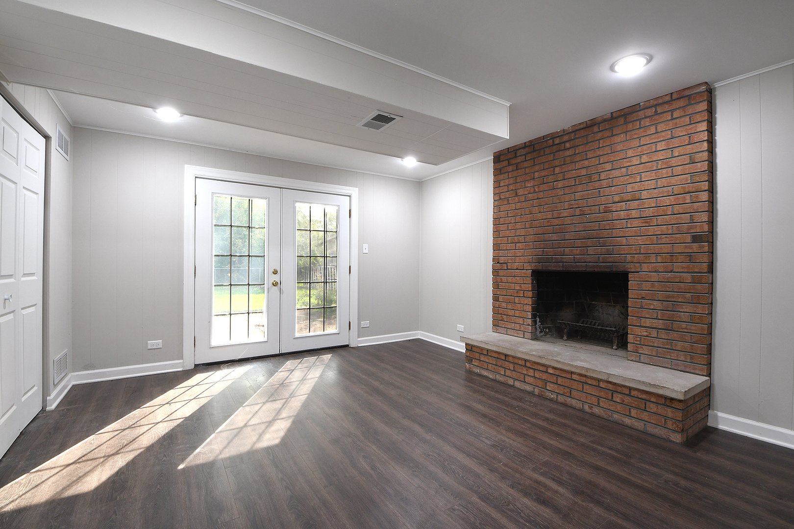 18938 Jonathan Lane Homewood, IL 60430 - Photo 10 of 33 a view of an empty room with wooden floor and a window