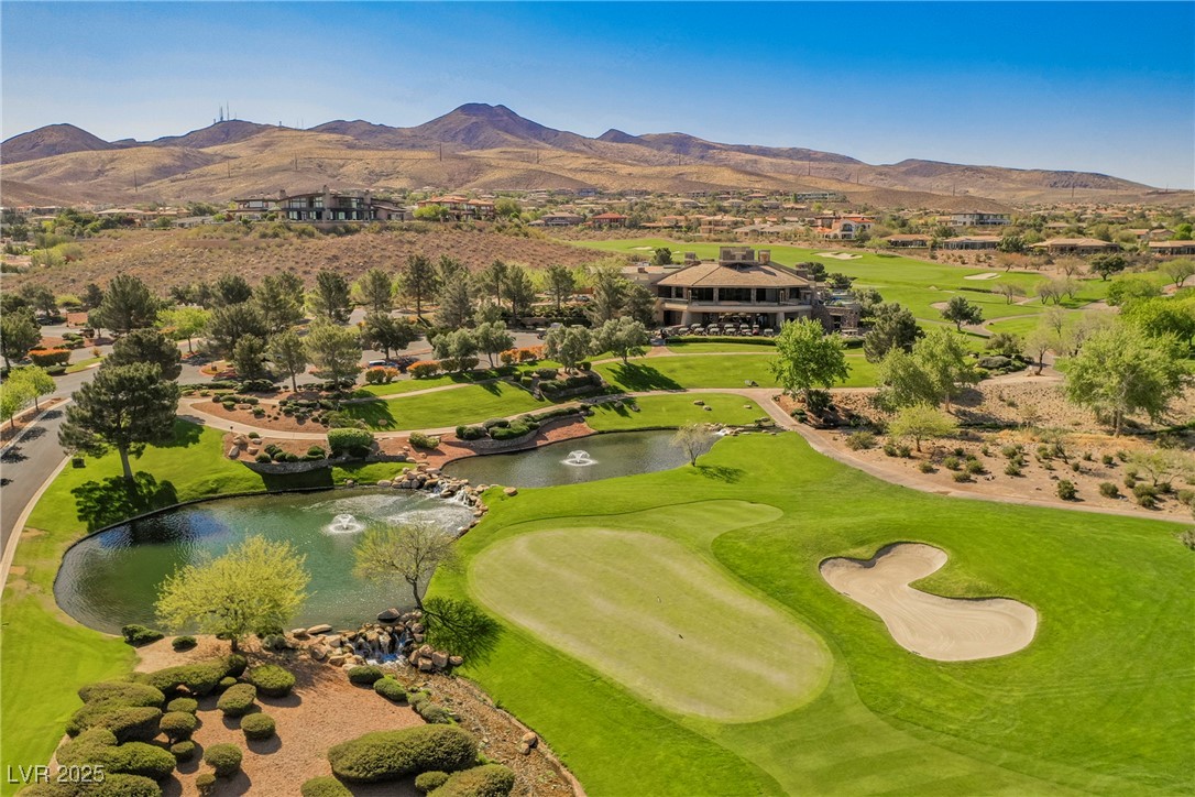 17 Caprington Road Henderson, NV 89052 - Photo 2 of 34 Drone / aerial view of a golf club and a water and mountain view