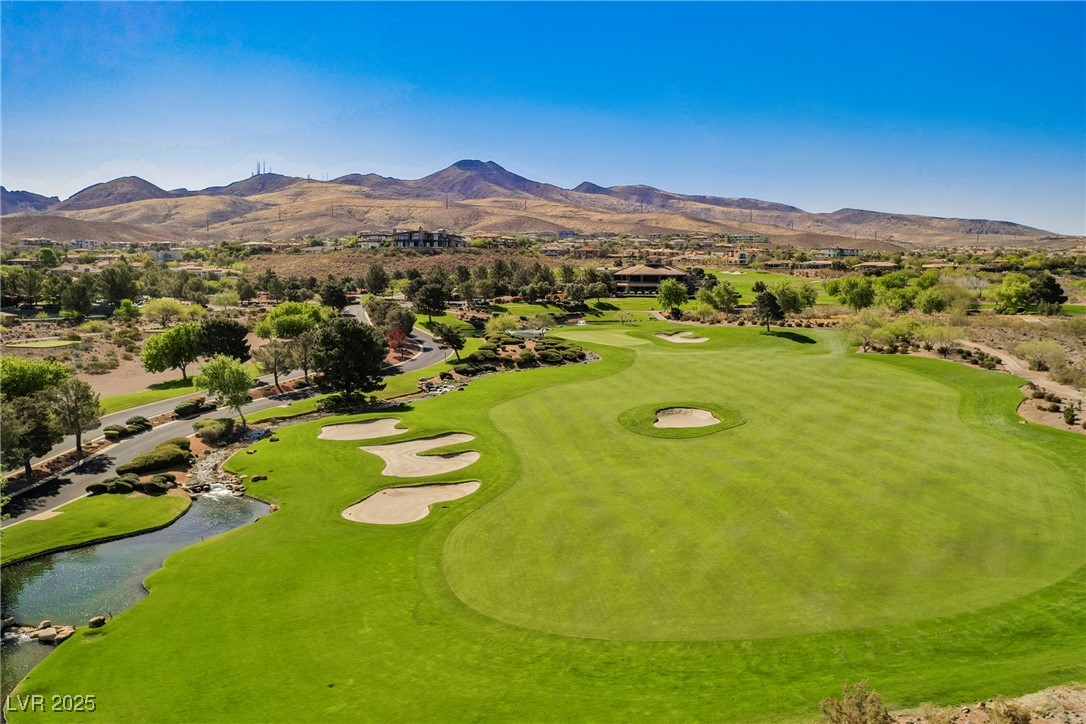 17 Caprington Road Henderson, NV 89052 - Photo 25 of 34 Drone / aerial view of a water and mountain view and a golf course