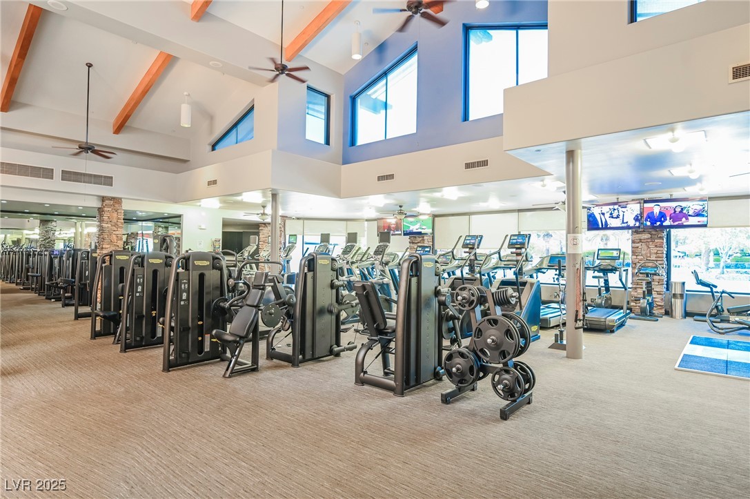 17 Caprington Road Henderson, NV 89052 - Photo 28 of 34 Workout area with carpet floors, high vaulted ceiling, beam ceiling, and a ceiling fan