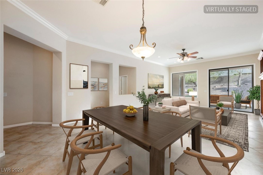 17 Caprington Road Henderson, NV 89052 - Photo 4 of 34 Dining area featuring ornamental molding, light tile patterned floors, and a ceiling fan