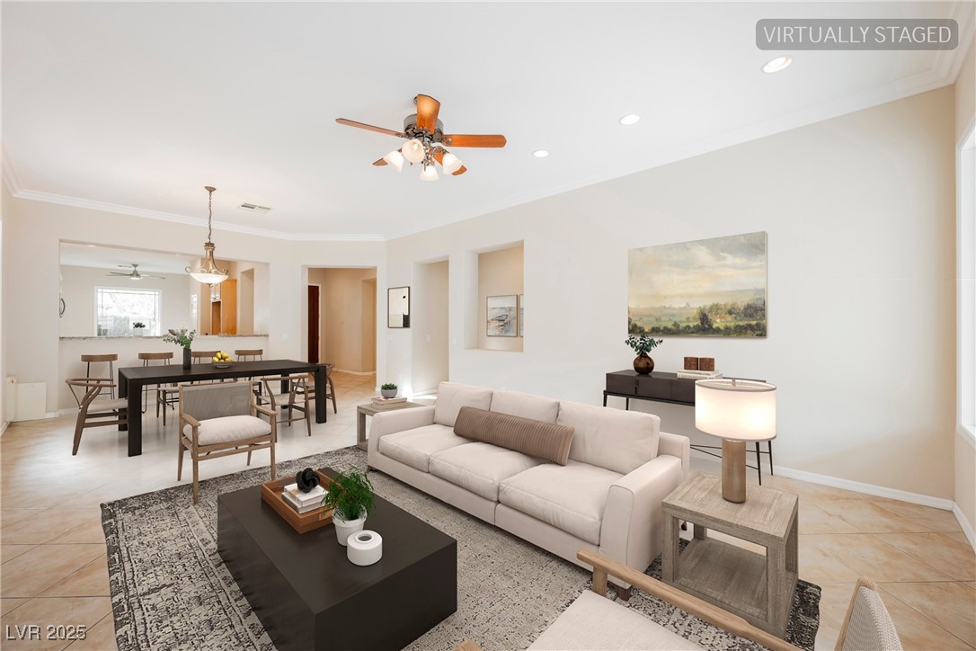 17 Caprington Road Henderson, NV 89052 - Photo 5 of 34 Living room featuring ornamental molding, light tile patterned floors, ceiling fan, and recessed lighting