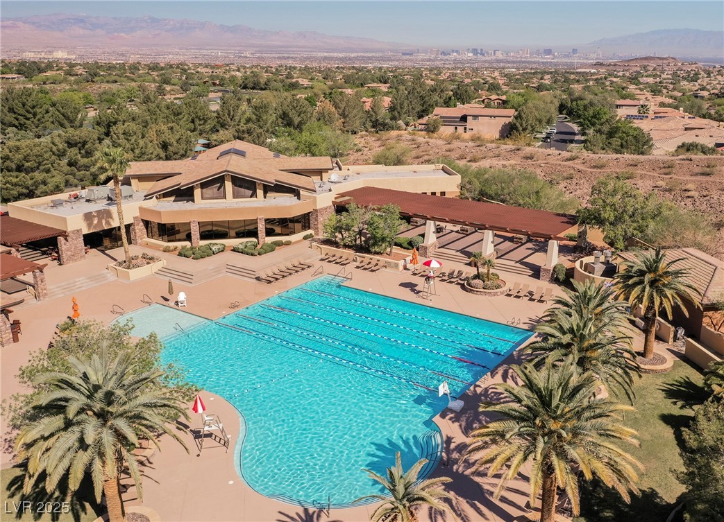 17 Caprington Road Henderson, NV 89052 - Photo 8 of 34 Community pool featuring a patio and a mountain view