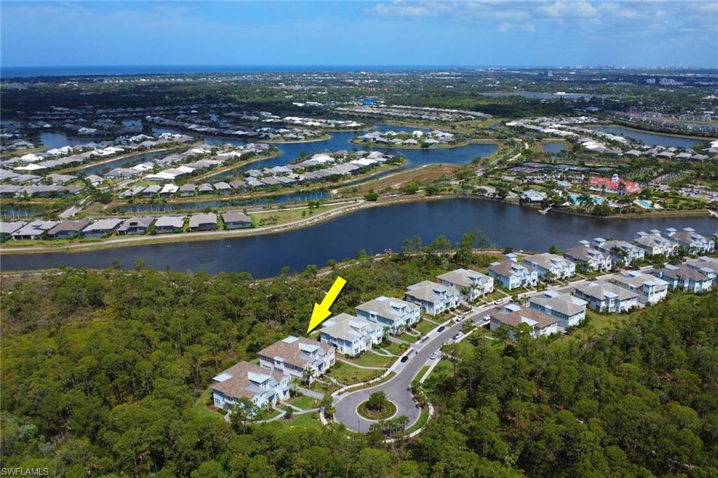 6509 Dominica Drive, Unit 101 Naples, FL 34113 - Photo 23 of 33 an aerial view of residential houses with outdoor space