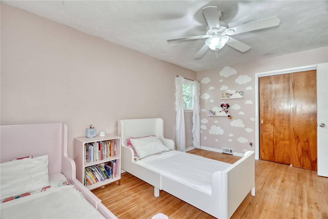 1038 Whalen Road Penfield, NY 14526 - Photo 27 of 46 Bedroom number three with ceiling, fan and hardwoo
