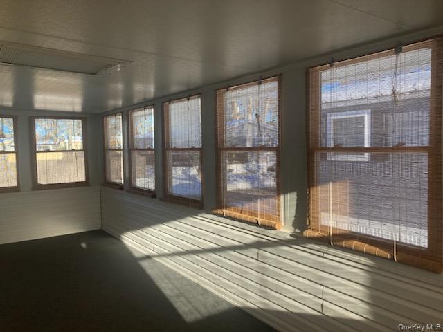 1661 Old Country Road Riverhead, NY 11901 - Photo 11 of 12 a view of a room with wooden floor and windows