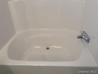 1661 Old Country Road Riverhead, NY 11901 - Photo 10 of 12 a bathroom with a bathtub