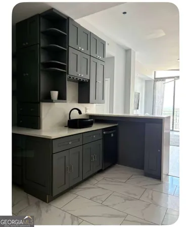 a kitchen with a sink and cabinets