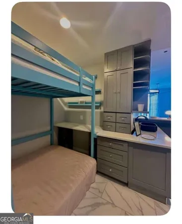 a kitchen with a refrigerator and cabinets