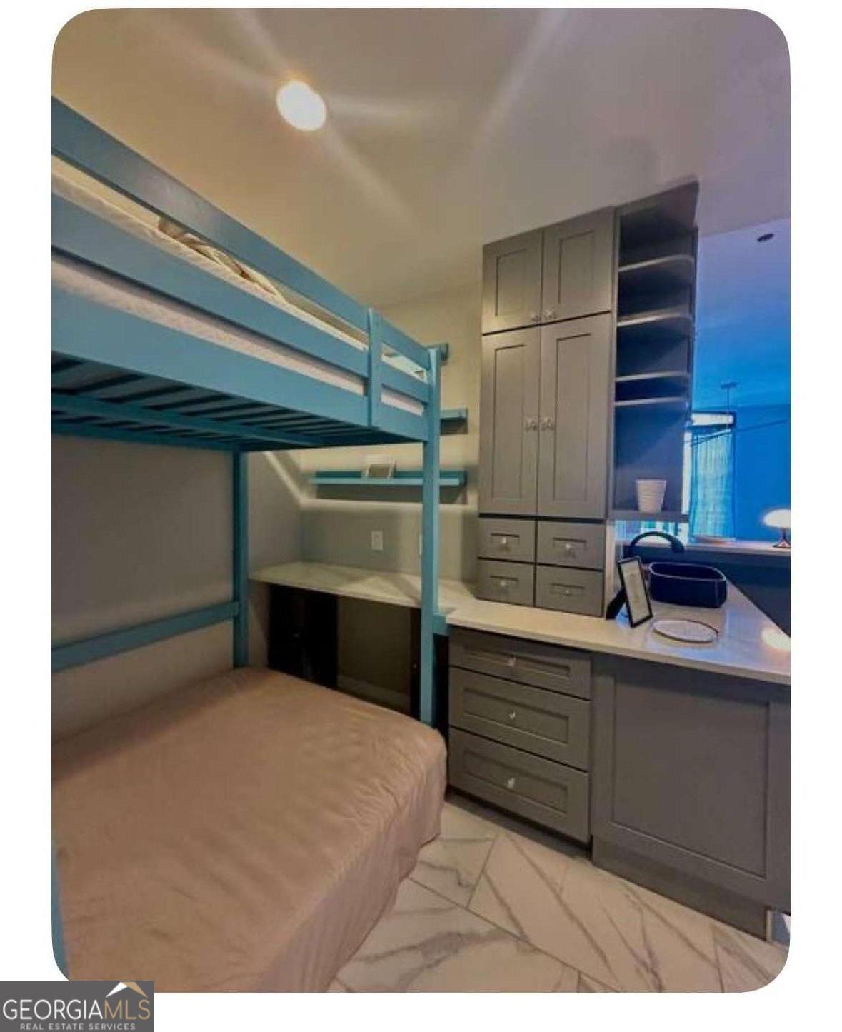 3040 Peachtree Road Northwest, Unit 1913 Atlanta, GA 30305 - Photo 5 of 12 a kitchen with a refrigerator and cabinets