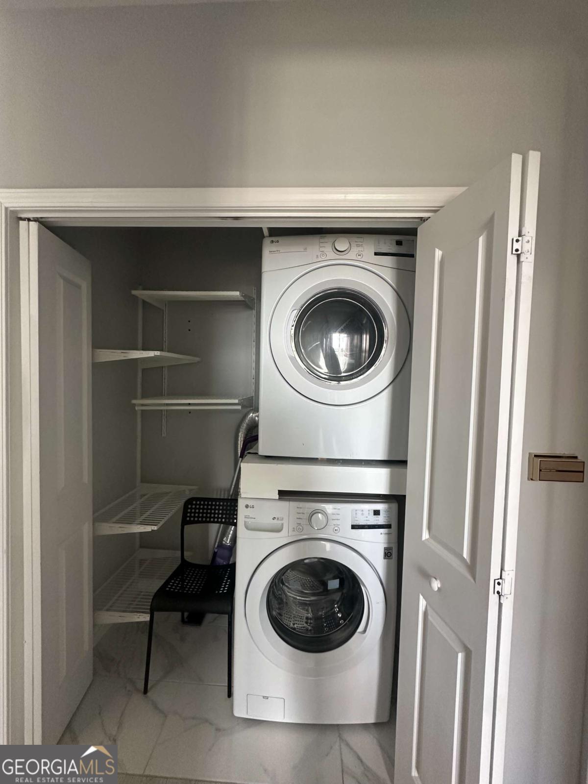 3040 Peachtree Road Northwest, Unit 1913 Atlanta, GA 30305 - Photo 9 of 12 a utility room with dryer and washer