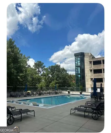 a view of swimming pool from a balcony