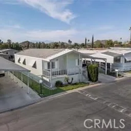 a view of multiple houses with a street