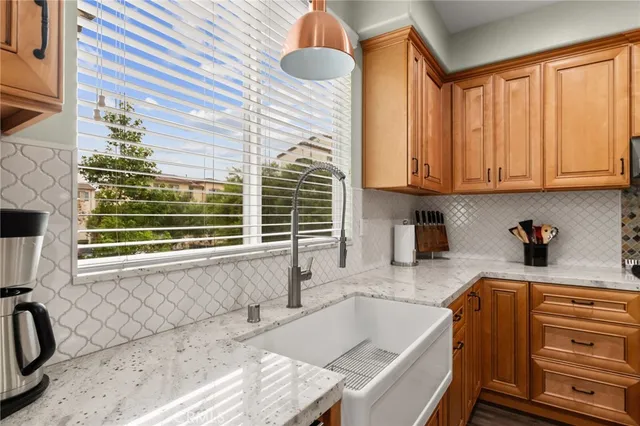 a kitchen with a sink and a window