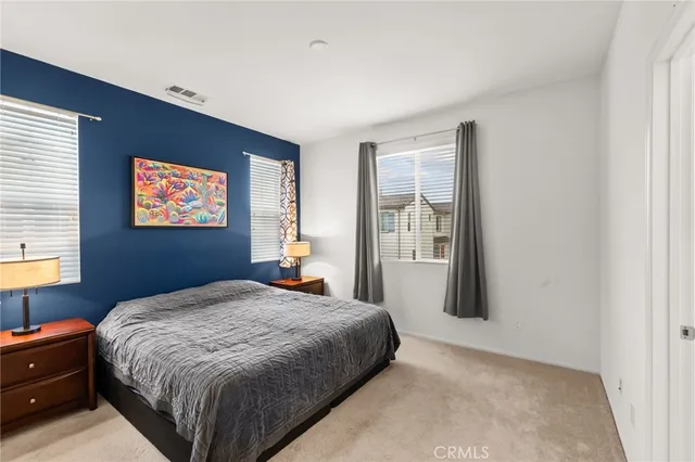 a bedroom with a bed and a closet