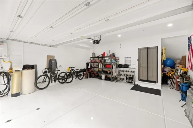 a view of a garage with a bike and a car