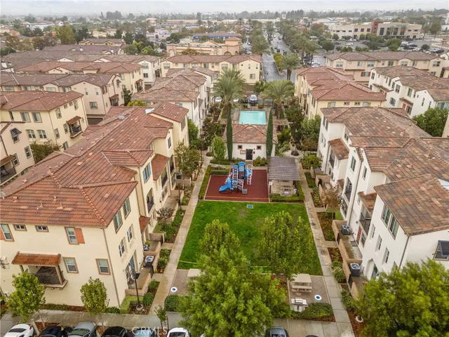 an aerial view of residential houses with outdoor space