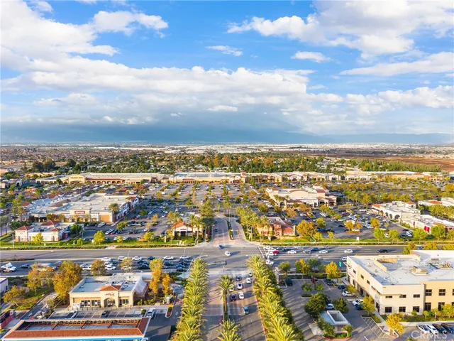 an aerial view of residential building and ocean view