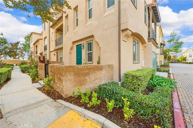 a view of a multi story building with a yard