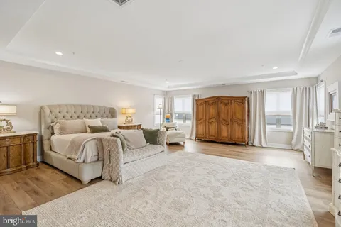 a spacious bedroom with a bed and a couch