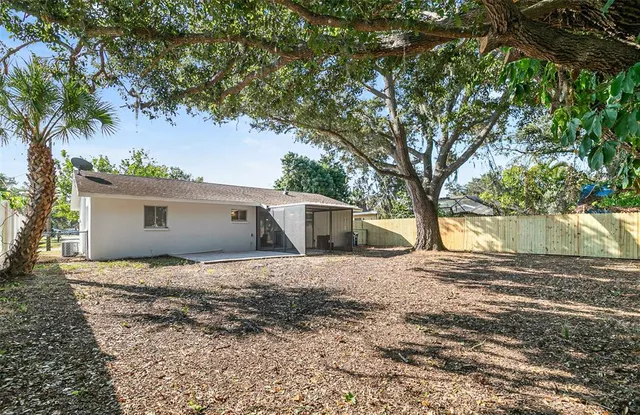 a view of a house with a tree