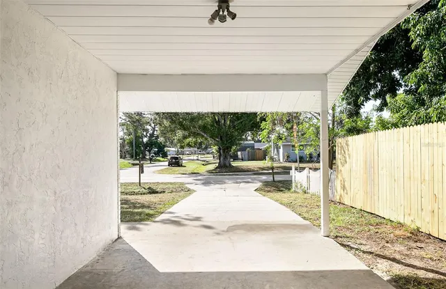 a view of a living room hardwood and a balcony