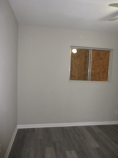 784 Terminal Court, Unit 10 Columbus, GA 31906 - Photo 12 of 26 an empty room with wooden floor and windows