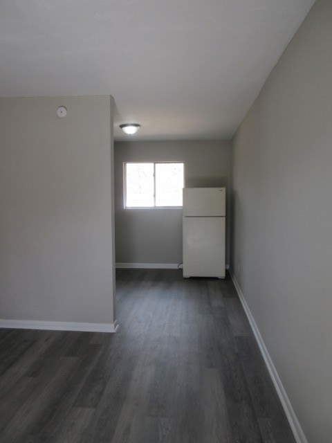 784 Terminal Court, Unit 10 Columbus, GA 31906 - Photo 3 of 26 an empty room with wooden floor and windows