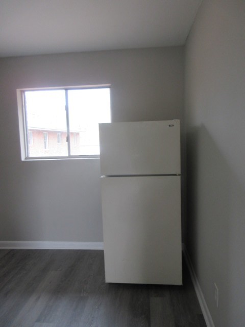 784 Terminal Court, Unit 10 Columbus, GA 31906 - Photo 6 of 26 a white refrigerator freezer sitting in a kitchen