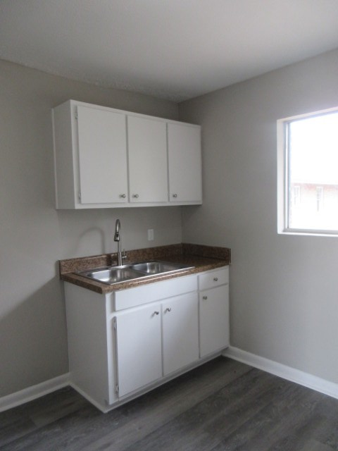 784 Terminal Court, Unit 10 Columbus, GA 31906 - Photo 7 of 26 a view of cabinets with wooden floor