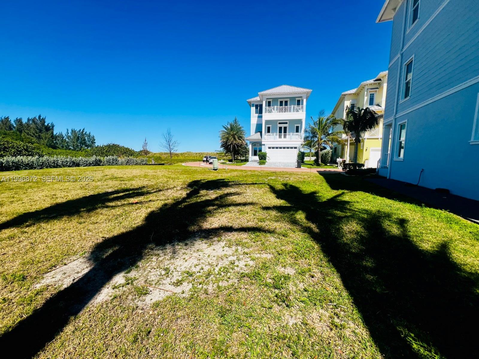 4803 Watersong Way Fort Pierce, FL 34949 - Photo 2 of 10 a view of a lake with a house
