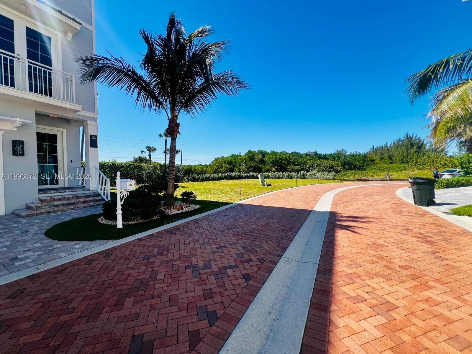 4803 Watersong Way Fort Pierce, FL 34949 - Photo 6 of 10 a view of a backyard with plants and swimming pool