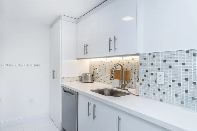 a bedroom with a bed and a lamp