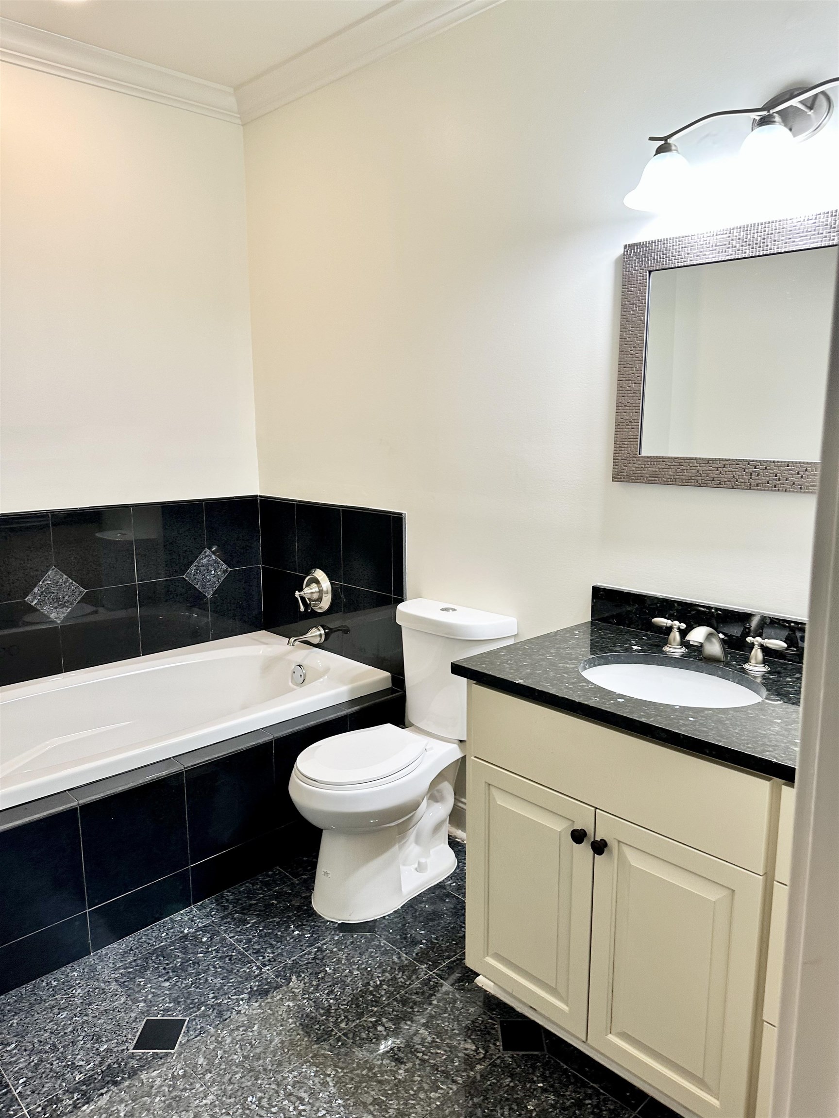 205 Jamerson Farm Road Collierville, TN 38017 - Photo 20 of 33 Bathroom with crown molding, tiled bath, vanity, and toilet