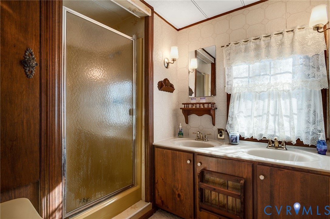 475 Dove Road Boydton, VA 23917 - Photo 15 of 45 a bathroom with a granite countertop sink and a mirror