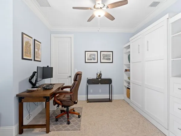 a view of a workspace with furniture