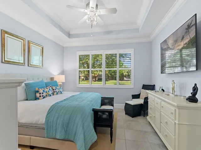 a view of a lake with couches and a big yard