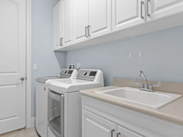 a view of a livingroom with furniture and a large window