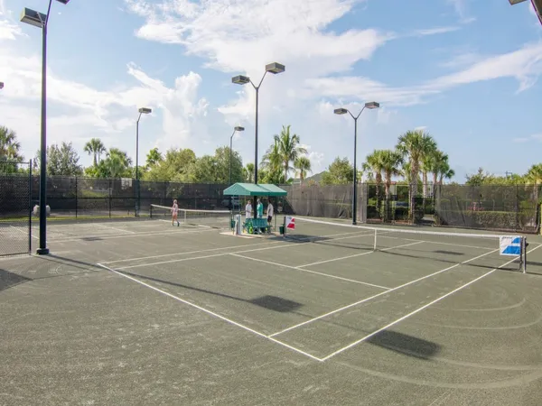 a view of a tennis court with basket ball court