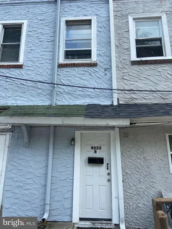a brick house with a door and a door