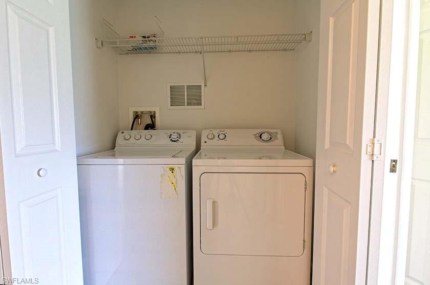 25064 Peacock Lane, Unit 102 Naples, FL 34114 - Photo 12 of 21 a utility room with dryer and washer