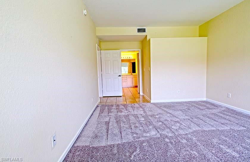 25064 Peacock Lane, Unit 102 Naples, FL 34114 - Photo 14 of 21 a view of a bathroom with a sink