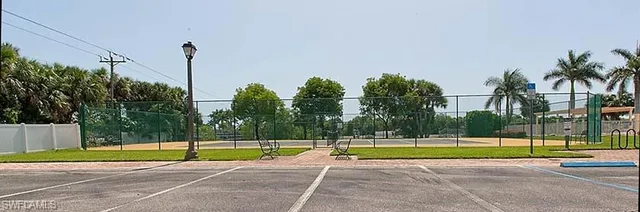 a view of a swimming pool with a yard